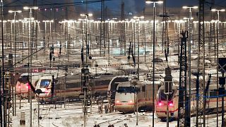 Deutsche Bahn ICE trains are parked on the tracks at the DB Fernverkehr plant in Hamburg, Germany Wednesday, Jan. 10, 2024.