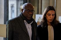 Sosthene Munyemana, a Rwandan doctor, arrives at the Palais de Justice with his lawyer Florence Bourg 