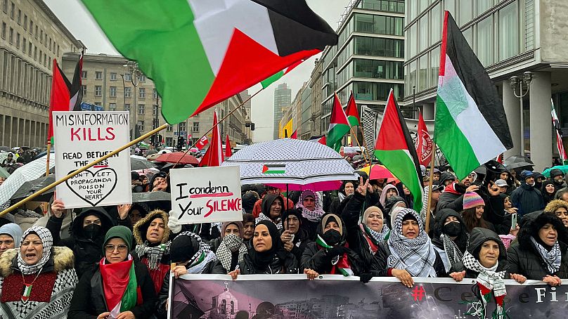Palestinian flags are seen during a pro-Palestinian rally in central Berlin on December 10, 2023.