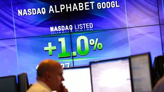 Electronic screens post the price of Alphabet stock.