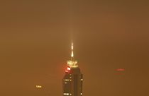 The Avaz Twist Tower building is seen through the haze as smog engulfs Sarajevo, Bosnia, Wednesday, Dec. 19, 2023