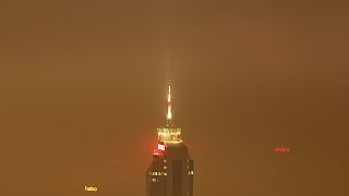 The Avaz Twist Tower building is seen through the haze as smog engulfs Sarajevo, Bosnia, Wednesday, Dec. 19, 2023