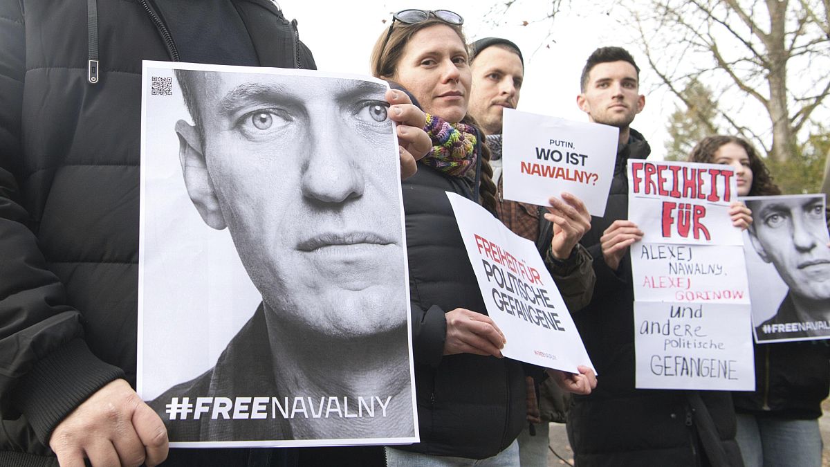 FILE - Demonstrators gather outside the home of Russian ambassador Sergei Netshaev in Berlin, Saturday Dec. 16, 2023, demanding the freedom for all political prisoners