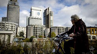 A cyclist rides past the headquarters of Dutch medical and consumer electronics manufacturer Philips in Amsterdam.