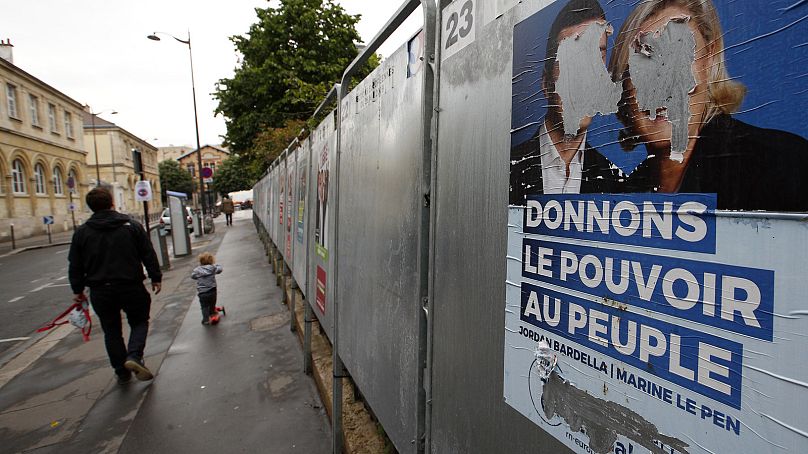 A torn campaign poster of the French far-right National Rally party during the 2019 European election campaign