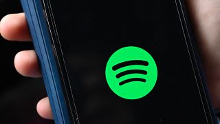 The company logo of Swedish music streaming giant spotify is pictured on a smartphone in Berlin