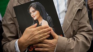 A portrait of Mahsa Amini is held during a rally calling for regime change in Iran following the death of Mahsa Amini in Washington, on Oct. 1, 2022.