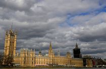 Clouds lour above the Houses of Parliament on the Embankment in London.