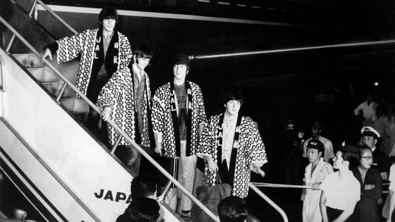 The Beatles arriving in Tokyo for their brief tour of Japan in 1966.