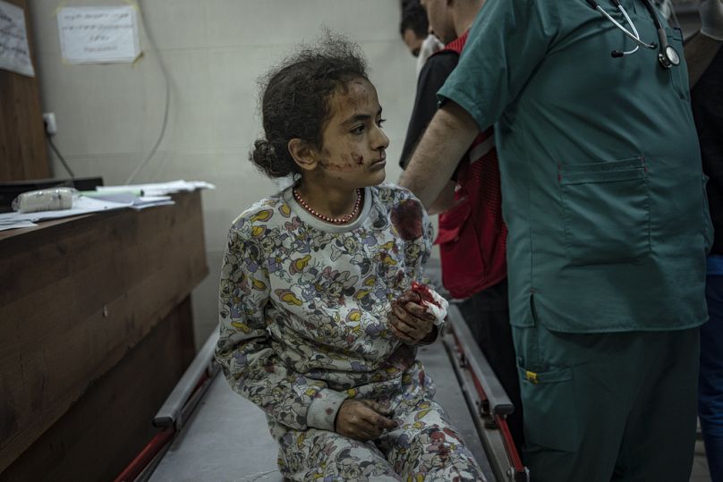 A Palestinian wounded in Israeli bombardment of the Gaza Strip is brought to a hospital in Khan Younis, November 2023