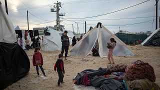 Palestinians displaced by the Israeli ground offensive on the Gaza Strip set up a tent camp in the Muwasi area Thursday, Dec. 7, 2023