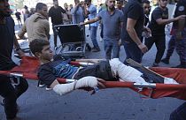 A Palestinian wounded in Israeli bombardment is brought to a hospital in Deir al-Balah, south of the Gaza Strip, Oct. 17, 2023.