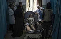 Palestinians who were arrested by the Israeli military in the north of the Gaza Strip and released through the Kerem Shalom crossing in the south wait for treatment in Rafah