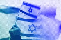 A demonstrator waves the flag of Israel during a rally in Bellevue, WA, October 2023