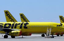 A line of Spirit Airlines jets sit on the tarmac at Orlando International Airport on 20 May 2020, in Orlando, Florida.