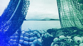 Fishing nets sit stacked on the deck of a fishing boat in Kodiak, AK, June 2023 