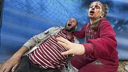 Wounded Palestinians react after an Israeli strike on Al Zawayda, central Gaza Strip, Thursday, Dec. 28, 2023. 