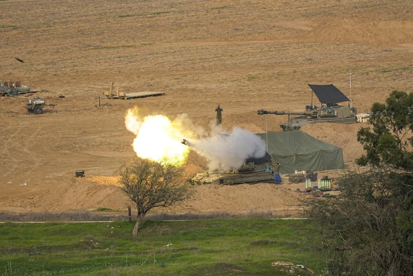 An Israeli mobile artillery unit fires a shell from southern Israel towards the Gaza Strip, in a position near the Israel-Gaza border, Wednesday, Dec. 27, 2023.