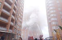 firefighters work on a site of a building damaged after a Russian attack in Kyiv, Ukraine, Friday, Dec. 29, 2023. 