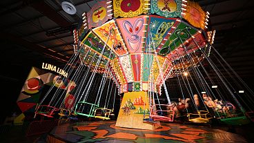 The Kenny Scharf painted chair swing ride in motion at "Luna Luna: Forgotten Fantasy", on December 22, 2023 in Los Angeles, California. 