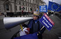 Anti-Brexit protester Steve Bray demonstrates on the edge of Parliament Square across the street from the Houses of Parliament, in London, Wednesday, Dec. 8, 2021.