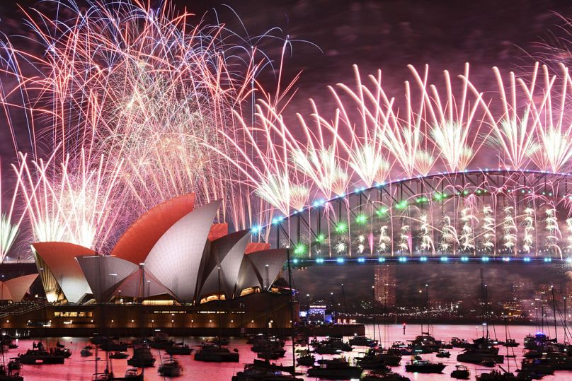 Fireworks explode over the Sydney Opera House and on the Harbour Bridge as part if New Year's Eve celebrations in Sydney, Monday, Jan. 1, 2024.