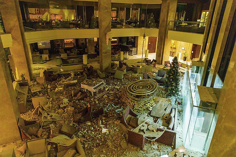 the ruined lobby of Kharkiv Palace Hotel is seen after Russia's missile attack in Kharkiv, Ukraine, Sunday, Dec. 31, 2023