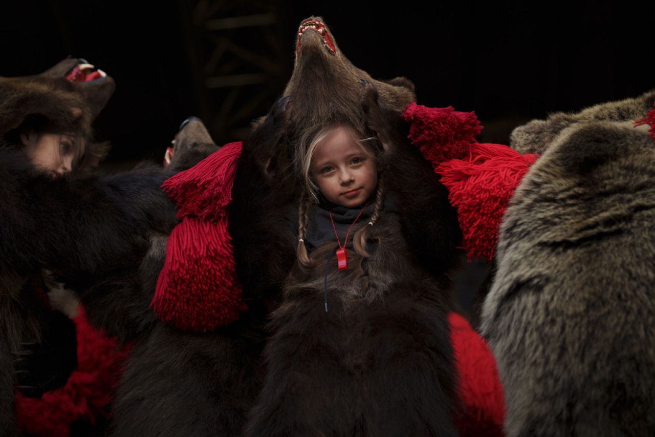 A child member of traditional bear pack performs in a festival in Moinesti, northern Romania, Wednesday, Dec. 27, 2023.