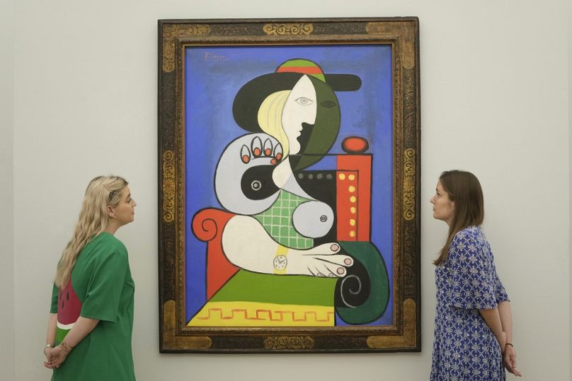The painting "Femme a la montre" by French artist Pablo Picasso in 1932, is on display during a media preview of Sotheby's auction, in London.