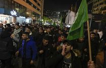 Palestinian demonstrators wave Hamas flags and shout slogans during a protest following the killing of top Hamas official Saleh Arouri in Beirut, in the West Bank.