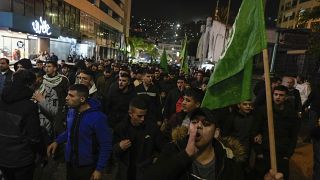 Palestinian demonstrators wave Hamas flags and shout slogans during a protest following the killing of top Hamas official Saleh Arouri in Beirut, in the West Bank.