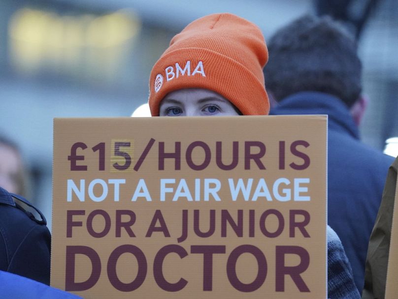 Junior doctors and members of the British Medical Association (BMA) demonstrate outside St Thomas' Hospital, London, Wednesday, Jan. 3, 2024,
