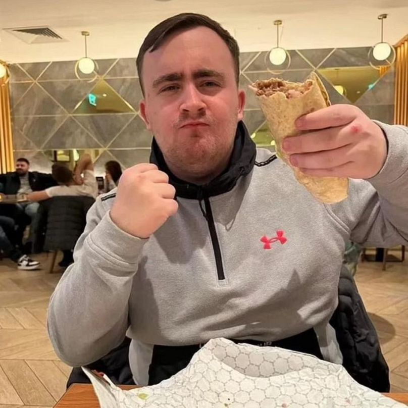 Luke Littler photographed with a kebab.