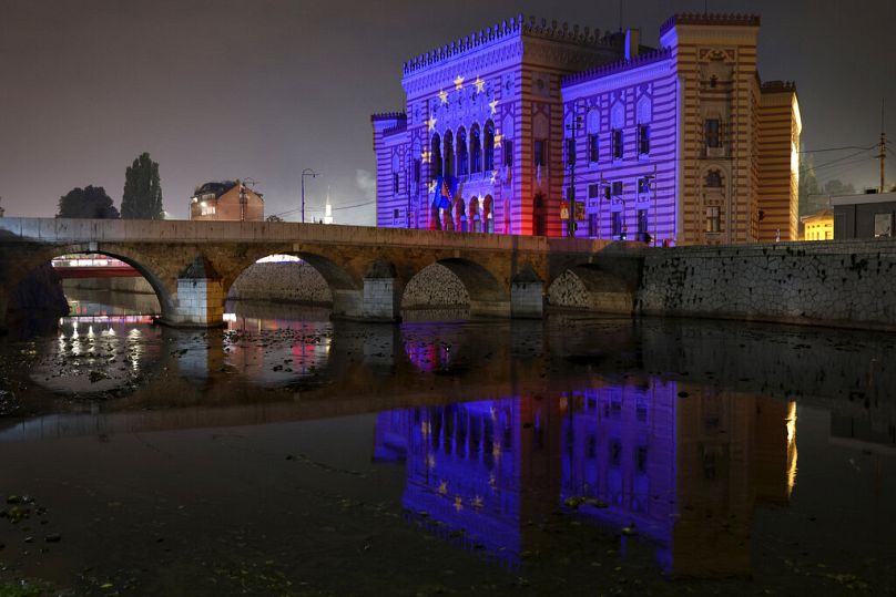 The European Union flag is projected on the National Library building in Sarajevo, October 2022