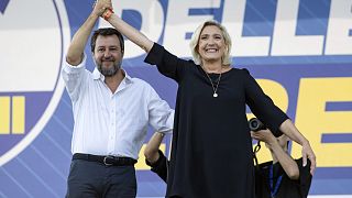 Italian Vice Premier Matteo Salvini, head of the populist, right-wing League, left, stands on stage with French right-wing leader Marine Le Pen