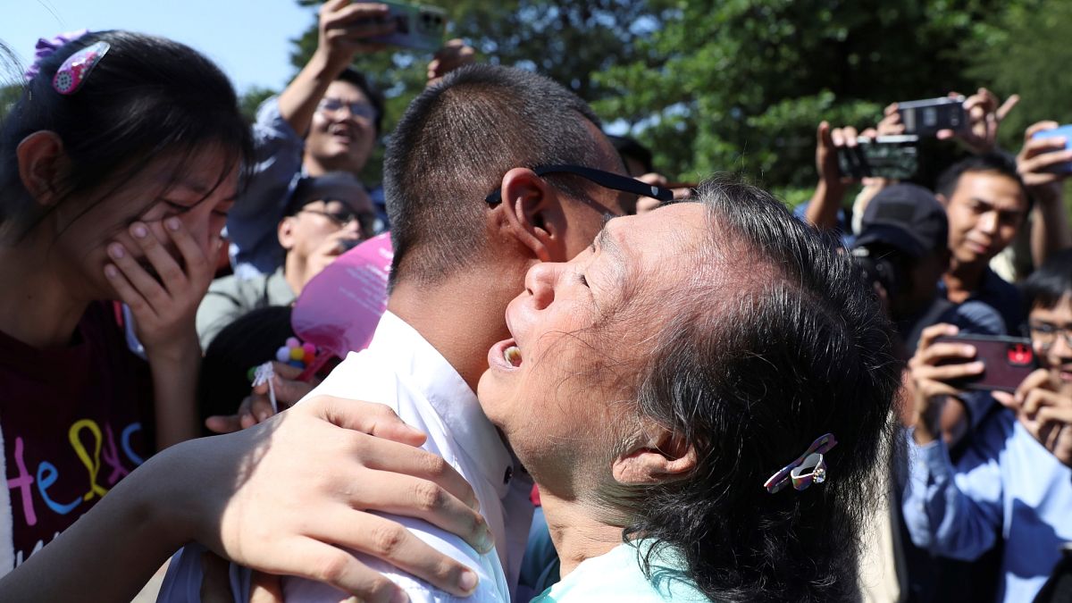 Kaung Sett Lin, center, photojournalist, is welcomed by family members and colleagues after he was released Insein Prison in Yangon, Myanmar, Thursday, Jan. 4, 2024.
