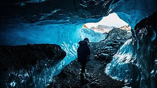 Explore ice caves in Vatnajokull, Iceland.