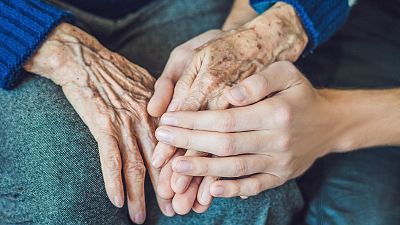 An elderly woman's hands.