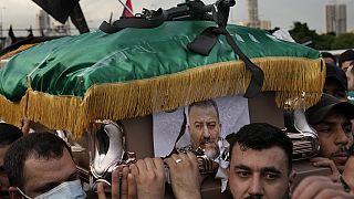 People attend the funeral of Saleh al-Arouri in Beirut on Wednesday 3 Jan