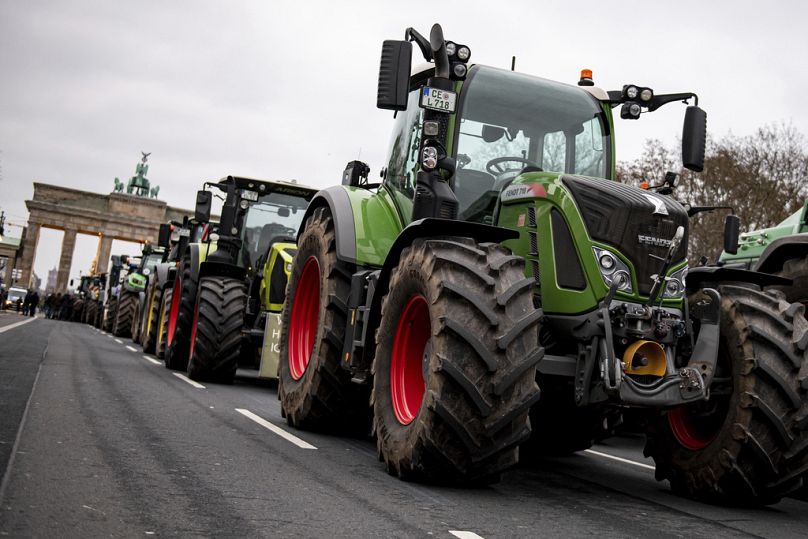 Farmers with tractors take part in a protest rally organized by the German Farmers' Association in Berlin.