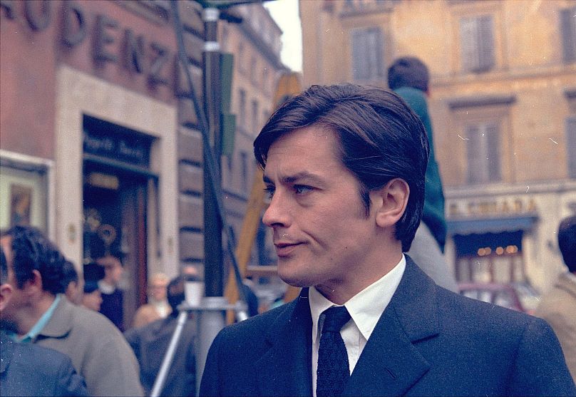 Alain Delon takes a short walk off the set of a new film, "The Sicilians," during a break in the shooting in the center of Rome March 27, 1969.