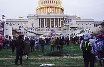 Rioters walk on the West Front at the U.S. Capitol on 6 January, 2021, in Washington DC