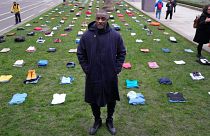 Idris Elba stands in Parliament Square with clothing representing the human cost of UK Knife Crime in London, Monday, Jan. 8, 2024. 
