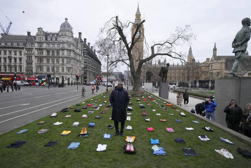 Idris Elba stands in Parliament Square with clothing representing the human cost of UK Knife Crime in London, 8 January 2024.