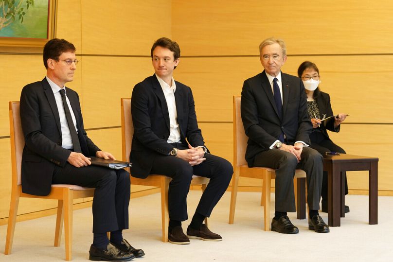 Frédéric Arnault (second from left) with his father, LVMH CEO Bernard Arnault (right), at a meeting at the Prime Minister's Office of Japan in Tokyo in 2022.