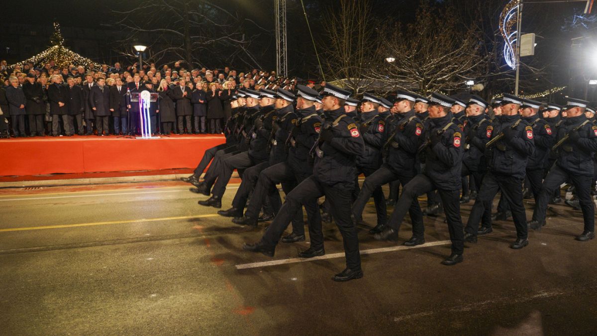 Members of the police forces of the Republic of Srpska march during a parade marking the 32nd anniversary of the Republic of Srpska, in the Bosnian town of Banja Luka, 240 kms
