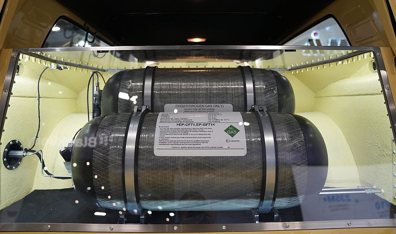Hydrogen gas fuel tanks designed by Motul in conjunction with GCK Battery are seen in the back of a vehicle retrofitted with a hydrogen combustion engine at 2024 CES.