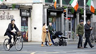 People go about their business in Dublin city centre, Tuesday March 17, 2020.