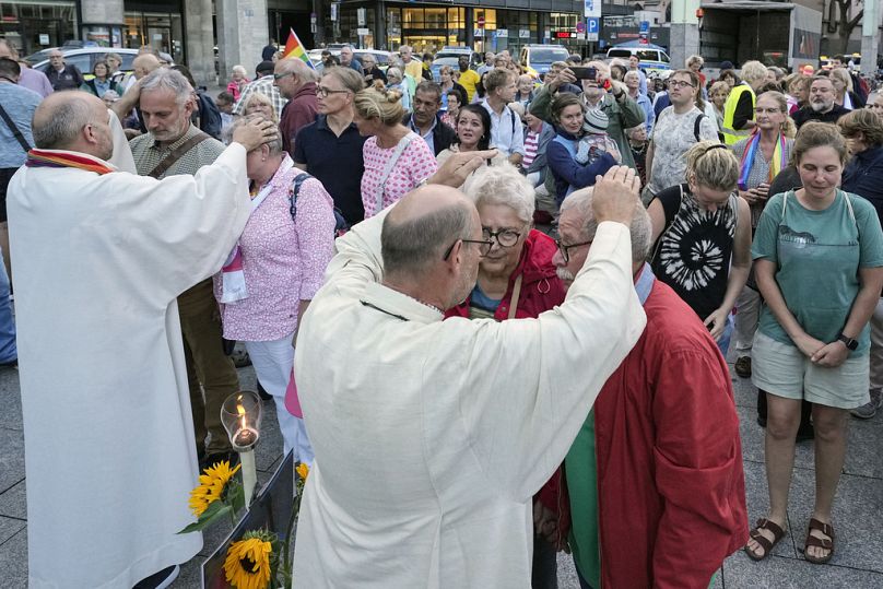 Married and same-sex couples take part in a public blessing ceremony in front of the Cologne Cathedral in Cologne, Germany, Wednesday, Sept. 20, 2023.