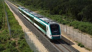 The inaugural train with President Andrés Manuel López Obrador on board passes near Chochola, Quintana Roo State, Mexico, 15 December 2023.